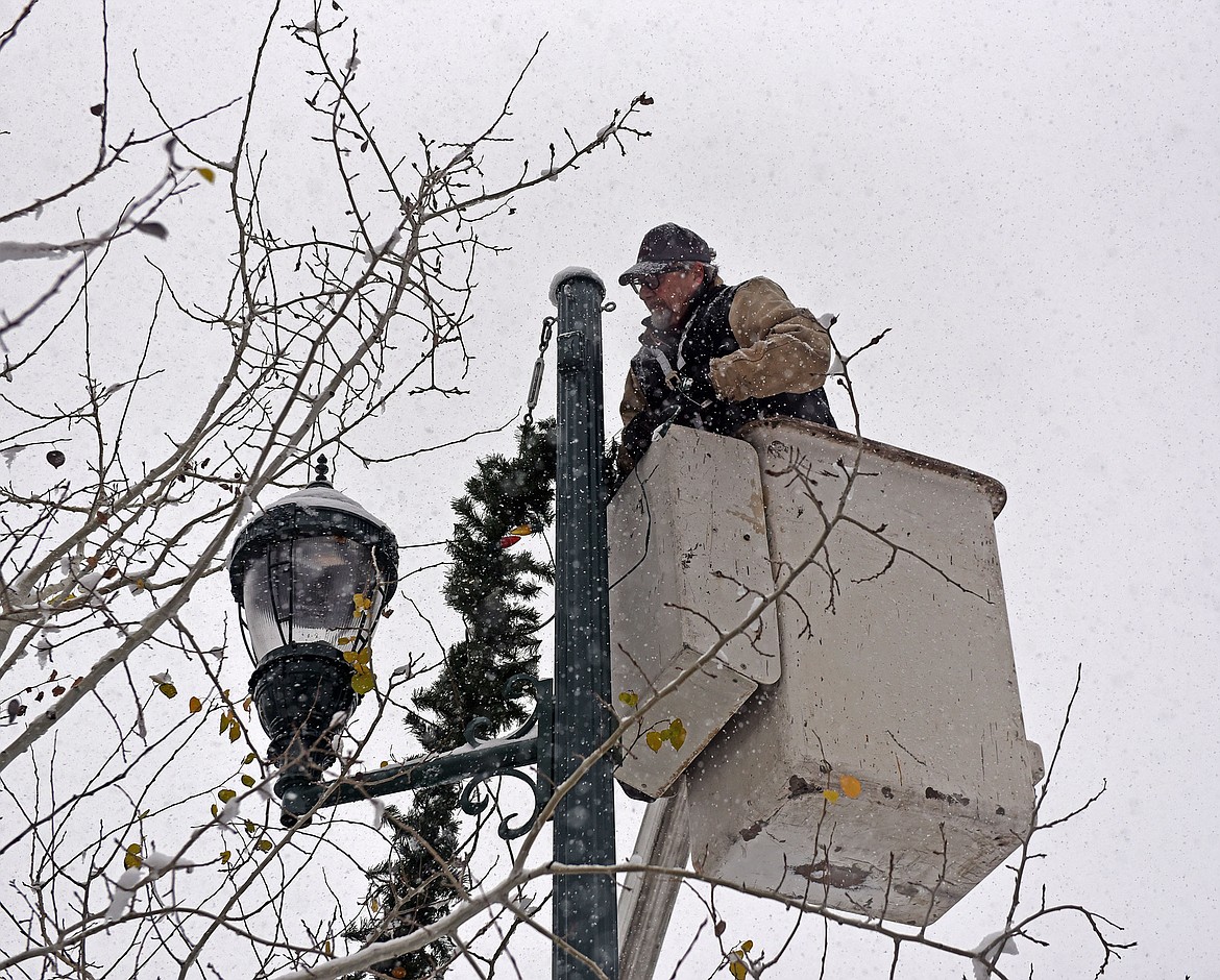 Whitefish's winter decorations were installed Sunday, Nov. 24, with help from several volunteers. (Julie Engler/Whitefish Pilot)