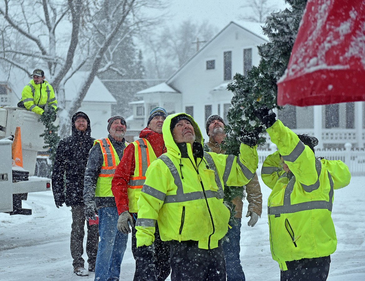 Whitefish's winter decorations were installed Sunday, Nov. 24, with help from several volunteers. (Julie Engler/Whitefish Pilot)