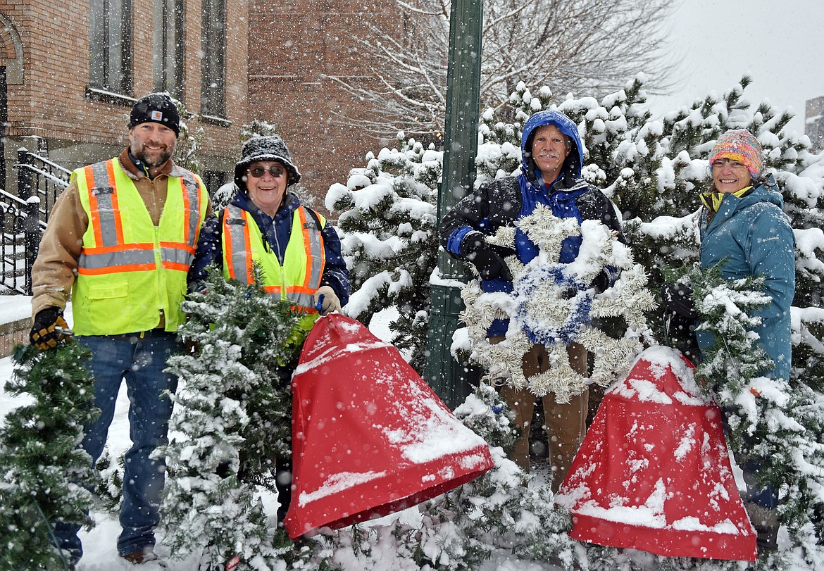 Whitefish's winter decorations were installed Sunday, Nov. 24, with help from several volunteers. (Julie Engler/Whitefish Pilot)