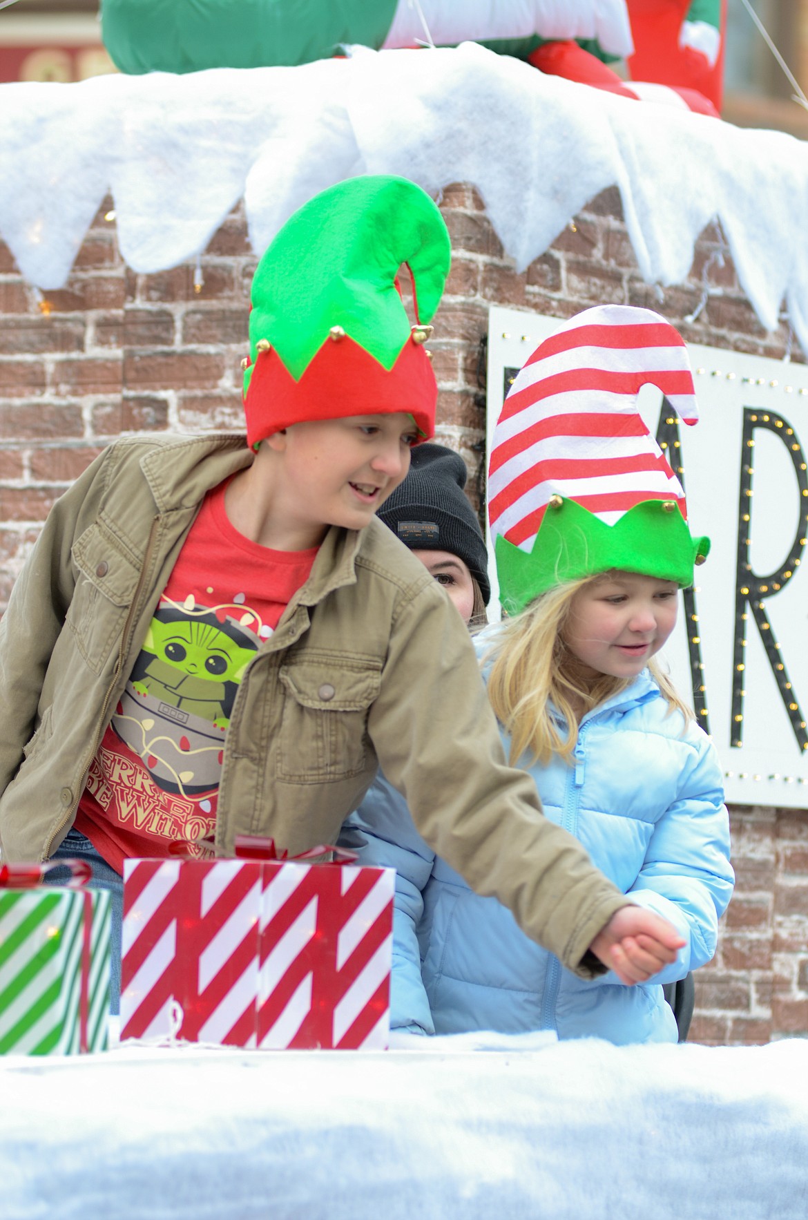 A couple of elves check out the view of the East Adams Rural Healthcare float at the Santa Parade in Ritzville last year.