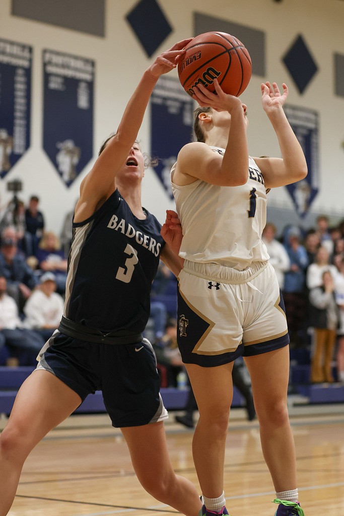 Bonners Ferry High senior forward Brooke Petesch blocks a Timberlake player from behind during an away game against the Lady Tigers last season.