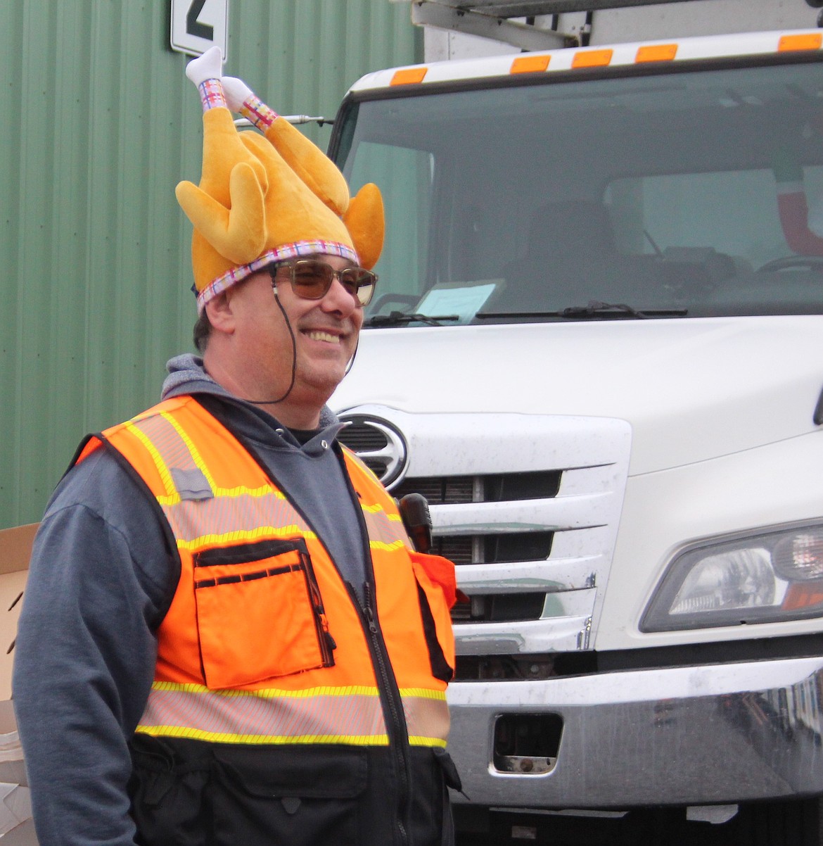 A Moses Lake Food Bank employee found a hat appropriate to the occasion at the Thanksgiving drive-thru.