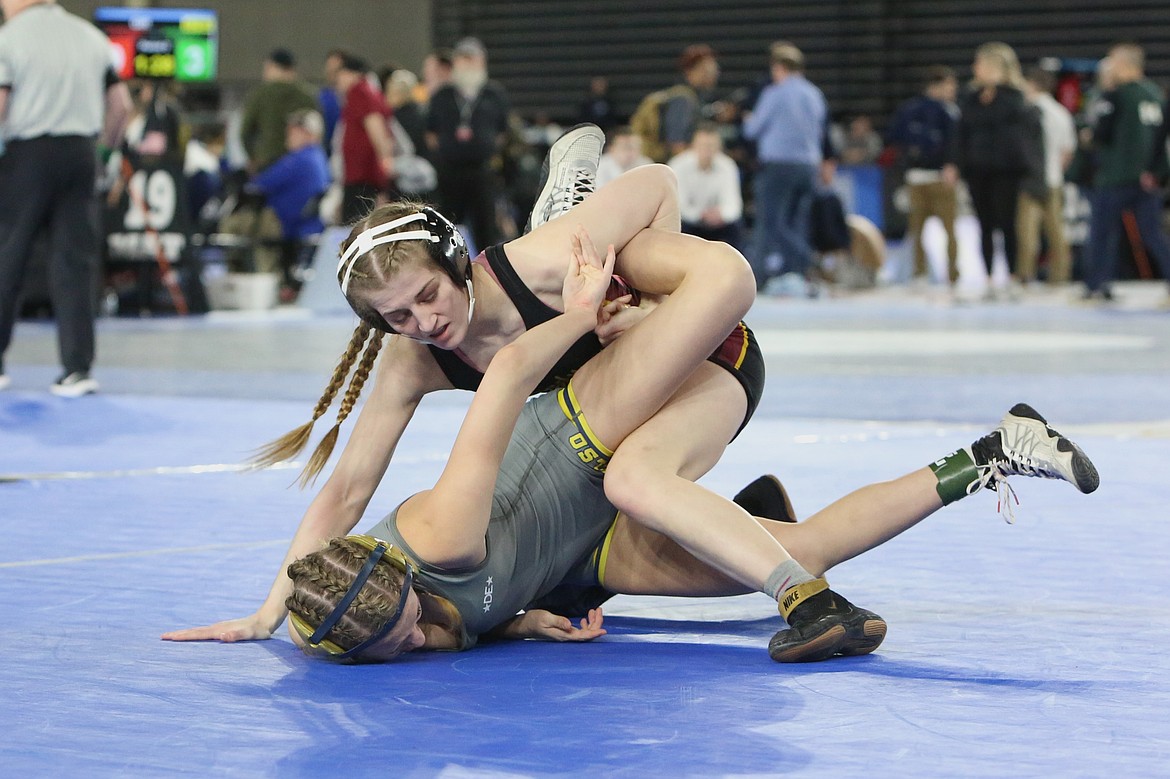 Moses Lake junior Reese Prescott, top, has recorded back-to-back second place finishes at the state tournament. Prescott is the only girls wrestler with state experience this season.