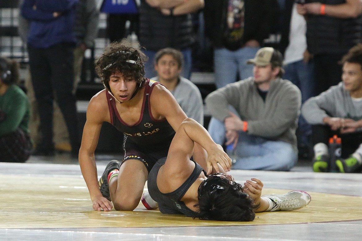 Moses Lake sophomore Duane Zamora, top, stands up after winning a match at the Mat Classic in February. Zamora took seventh in the 4A 120-pound weight class last season and is Moses Lake’s only returning placer in boys wrestling.