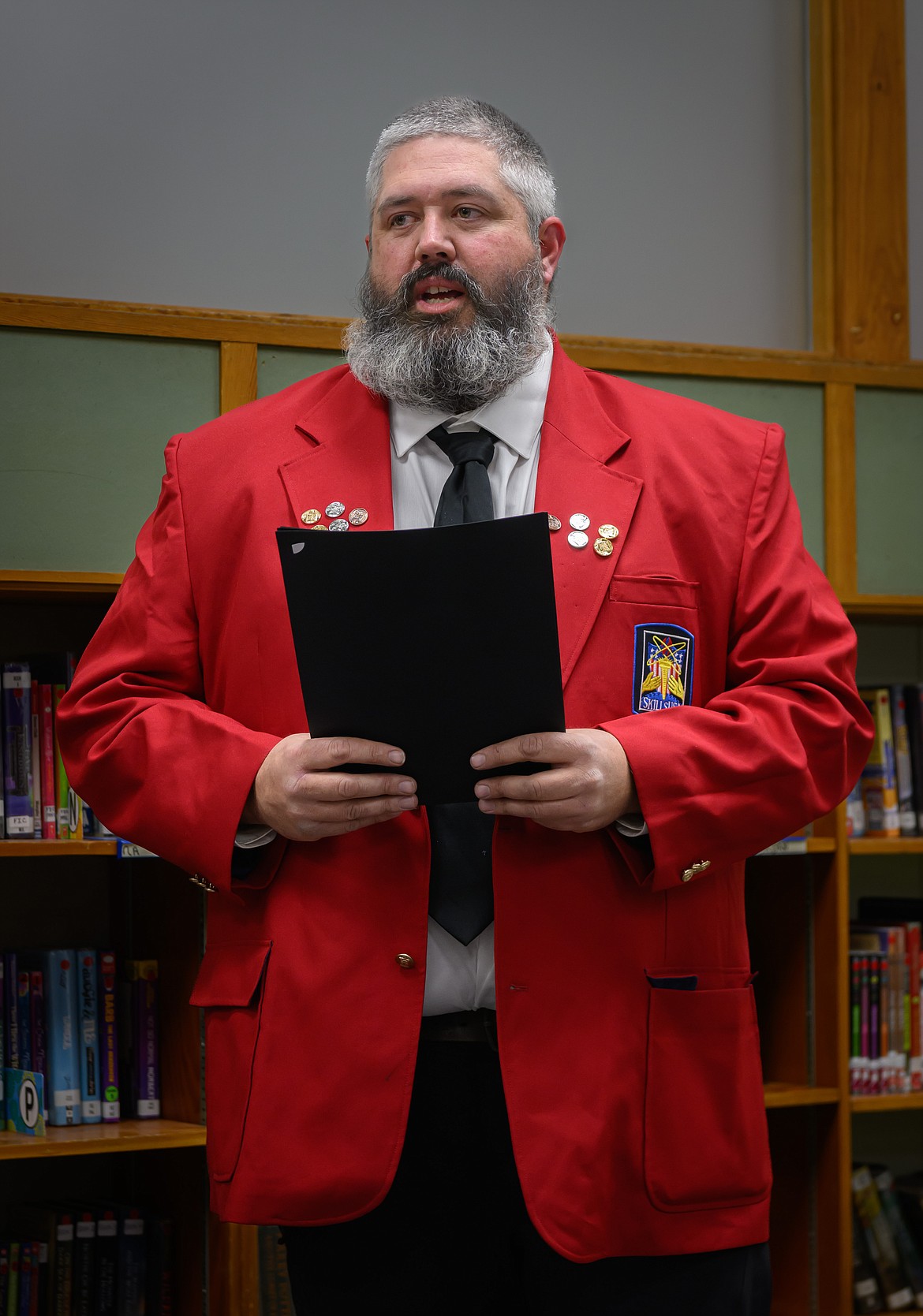 Shop teacher Kyle Mitchell speaks at the Plains School Board meeting in November. (Tracy Scott/Valley Press)