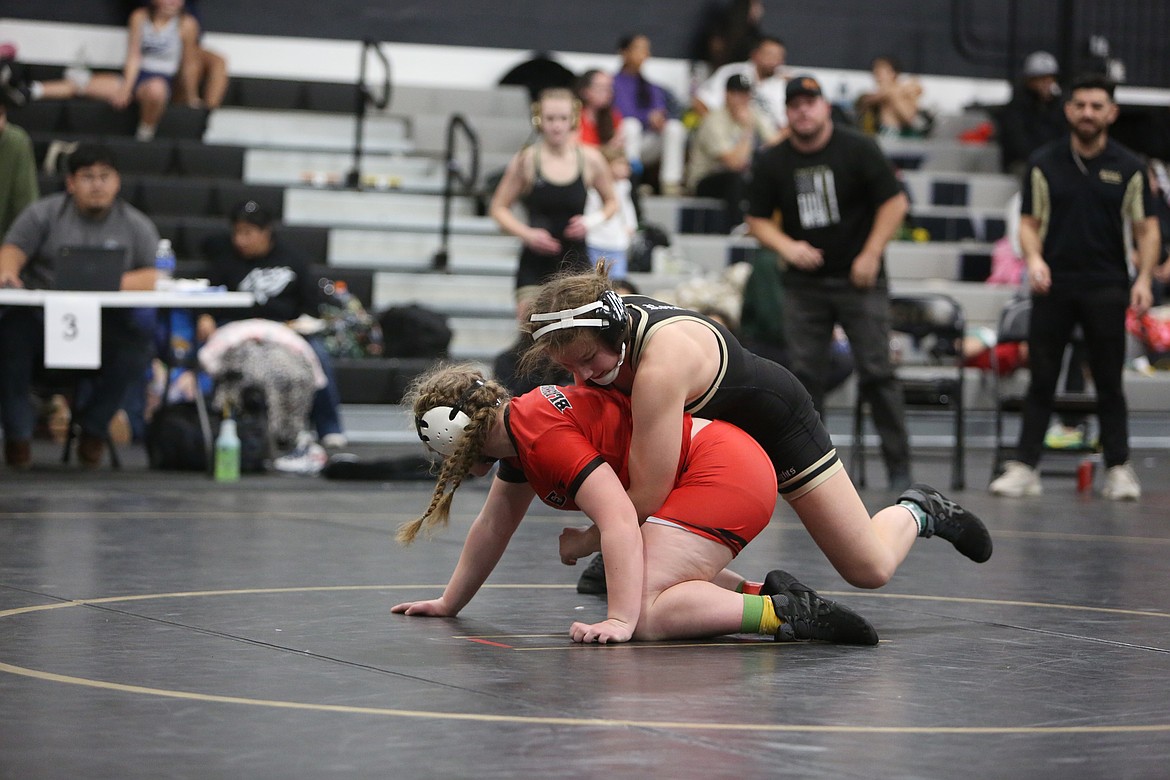 Senior Lauren Jenks, Royal, puts an opponent at a disadvantage in the Knights’ home tournament.