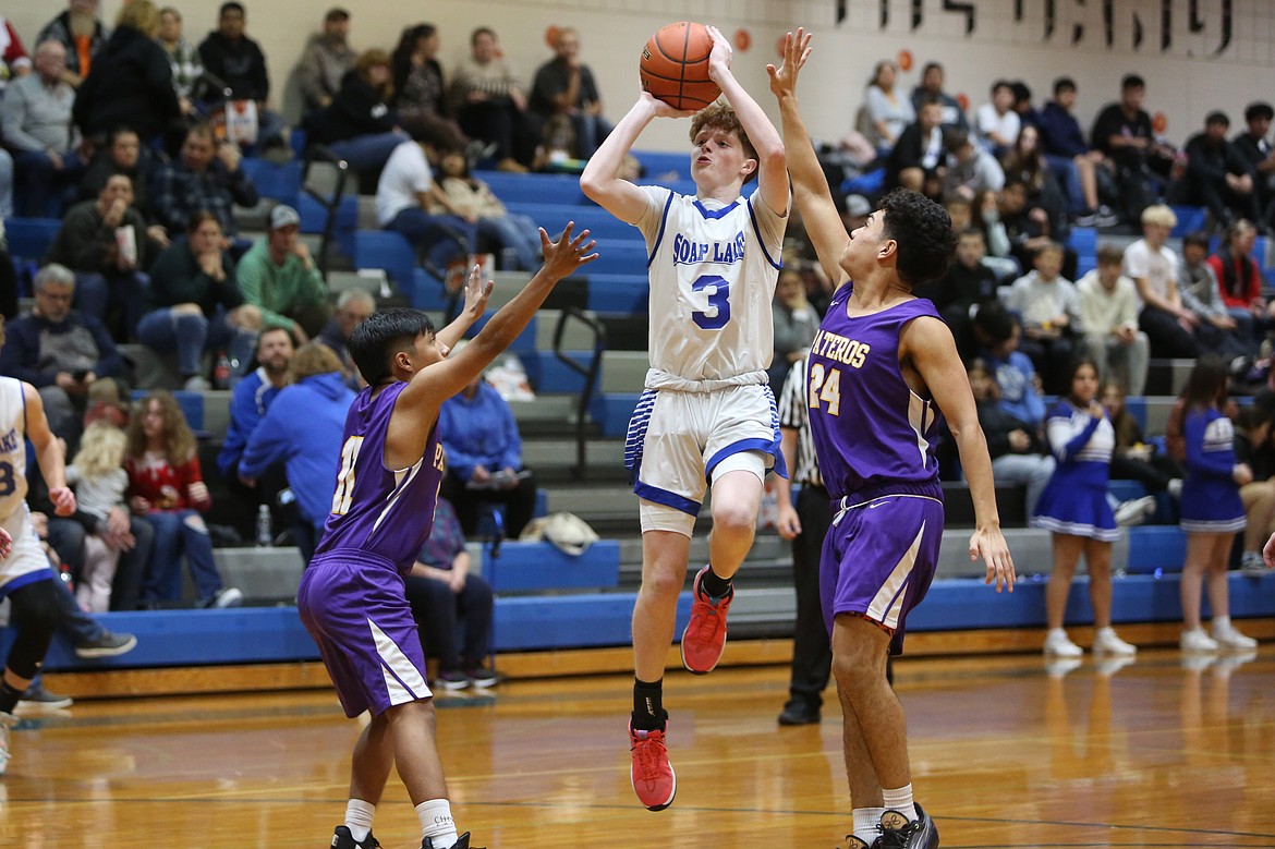 Soap Lake’s Trey Landdeck (3) attempts a three-pointer during a game last season. Landdeck was the Central Washington B league MVP last season and one of two Eagles who graduated in June. The Eagles also lost all-time leading scorer Pavlo Stoyan.