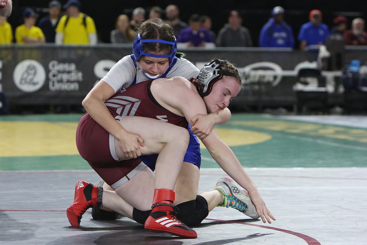 Warden junior Ashley Cruz, background, wrestles at the 2024 Mat Classic at the Tacoma Dome. The Cougars had five wrestlers qualify for the 2A/1A/2B/1B Girls state tournament last year, with Cruz being the lone returner this season.