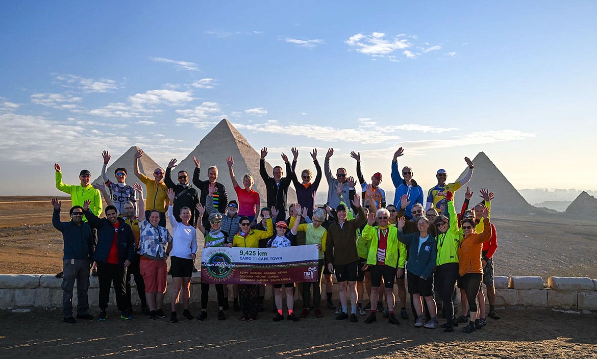 A group shot at the pyramids at the start of the Cairo to Cape Town tour. (Photo by TDA Global Cycling)