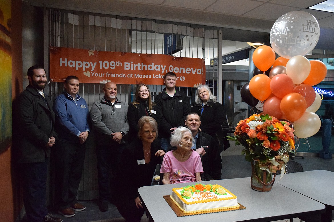 A team at Safeway helped set up the Jet A Way Café with decorations, flowers, balloons and a cake for Geneva Scott’s 109th birthday. The back row from left to right is Drew Dillery, Matt Teed, Darin Gerimonte, Kelsie Lund, Josh Edwards and Debbie North. The front row from left to right is District Manager Tina Riddle, Birthday Girl, Geneva Scott and Moses Lake Store Director Ed Wilson.