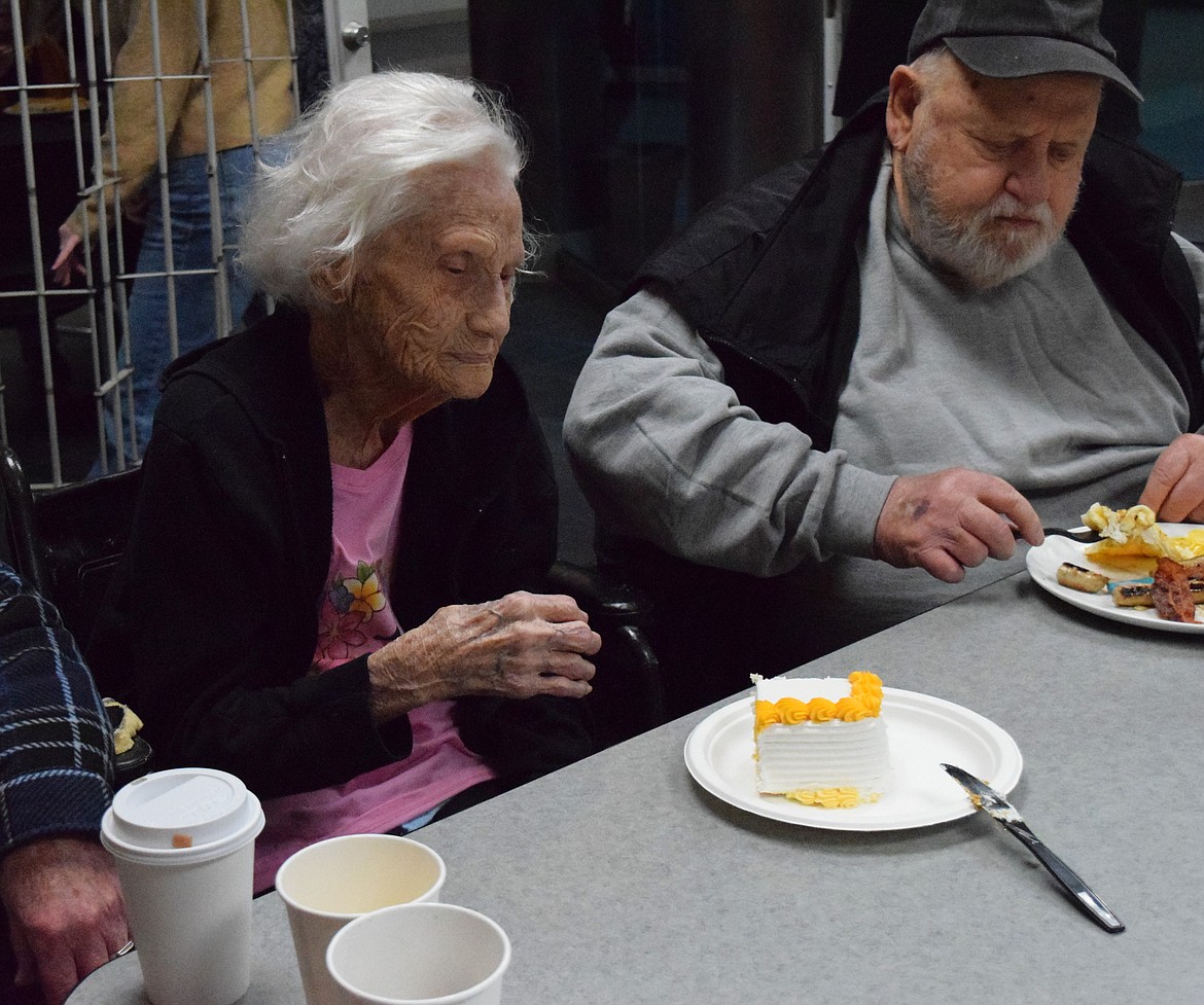 Geneva Scott, left, waits patiently for a fork to eat her birthday cake. The cake was provided by Safeway after her family reached out letting them know she would be turning 109.