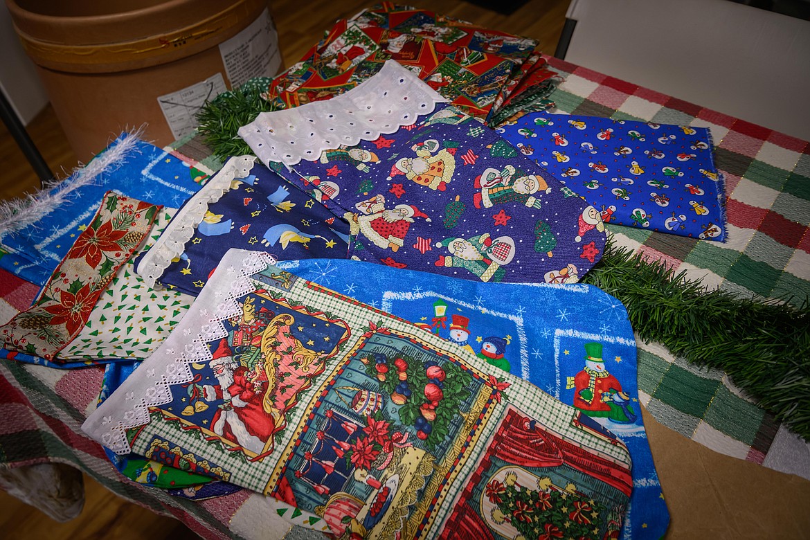 The pile of finished Christmas stockings grows thanks to the Plains Woman's Club. (Tracy Scott/Valley Press)