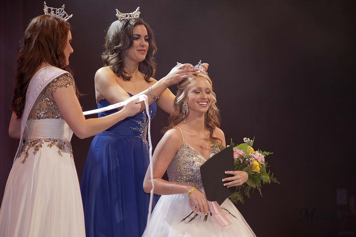 Miss East Cascades 2013 Lacey Ebert passes the crown on to her successor, Ashley Lowers.