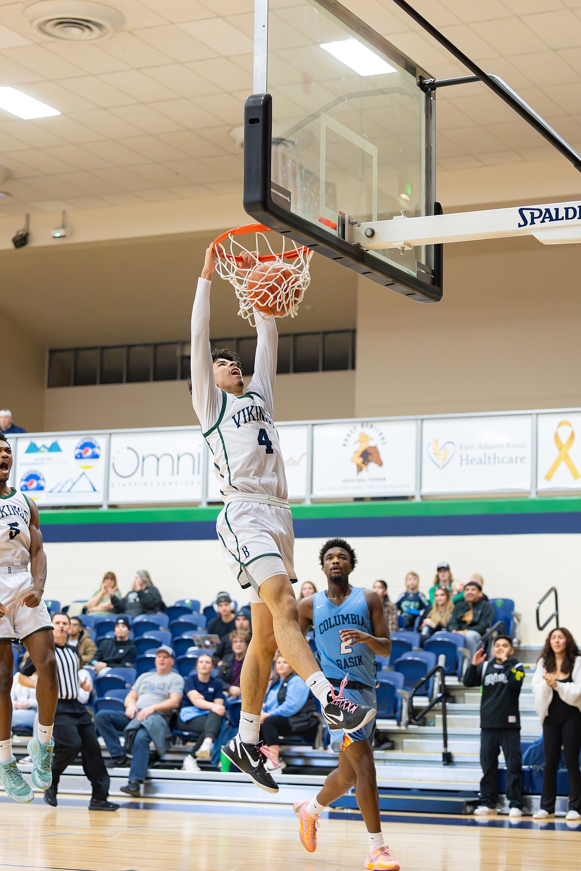 Diego Carrera, a six-foot-seven sophomore from El Paso, Texas, goes up for a shot against Columbia Basin College.