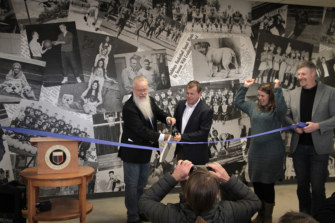 Jim Russell and Sandpoint Mayor Jeremy Grimm cut the ribbon on the James E. Russell Sports Center.