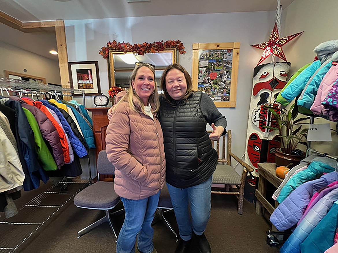 Stephanie Rief, Selkirk Association of Realtors, and Debbie Love, Bonner Community Food Bank are pictured among a few of the coats available at the Sandpoint location of the food bank.