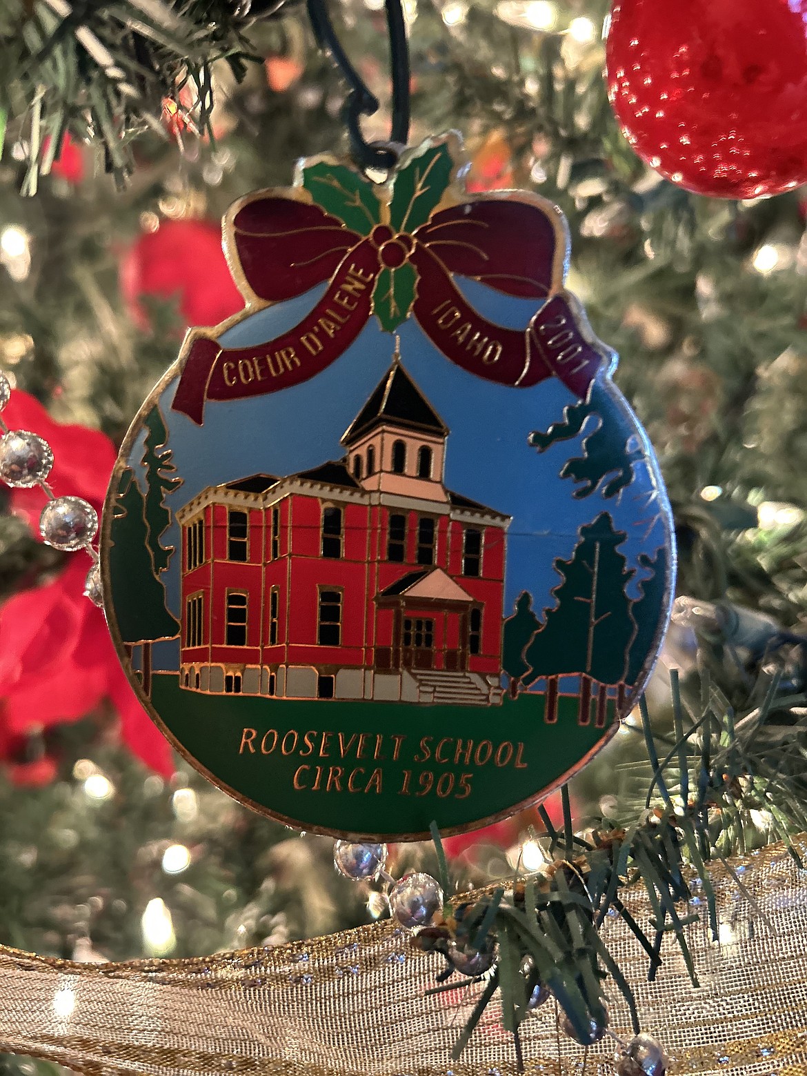 An ornament that depicts the Roosevelt School hangs on a Christmas tree at the Roosevelt Inn.