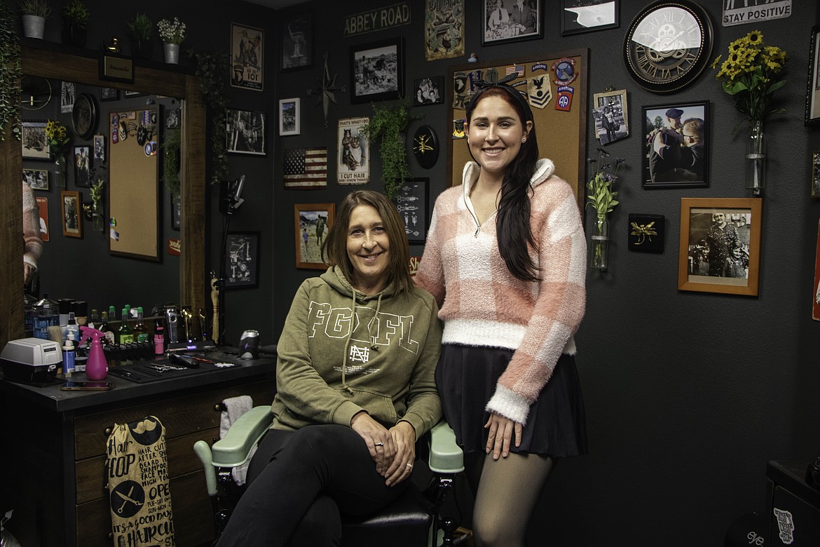 Amanda Scarlett, left, and her daughter Katrina Harris, right, in their newly opened Kalispell barber shop, Kalispell Barber Company. (Kate Heston/Daily Inter Lake)