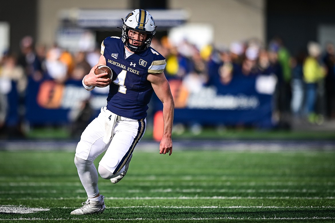 Bobcats quarterback Tommy Mellott (4) picks up yardage on a run in the first quarter against the Grizzlies during the 123rd Brawl of the Wild at Bobcat Stadium on Saturday, Nov. 23. (Casey Kreider/Daily Inter Lake)