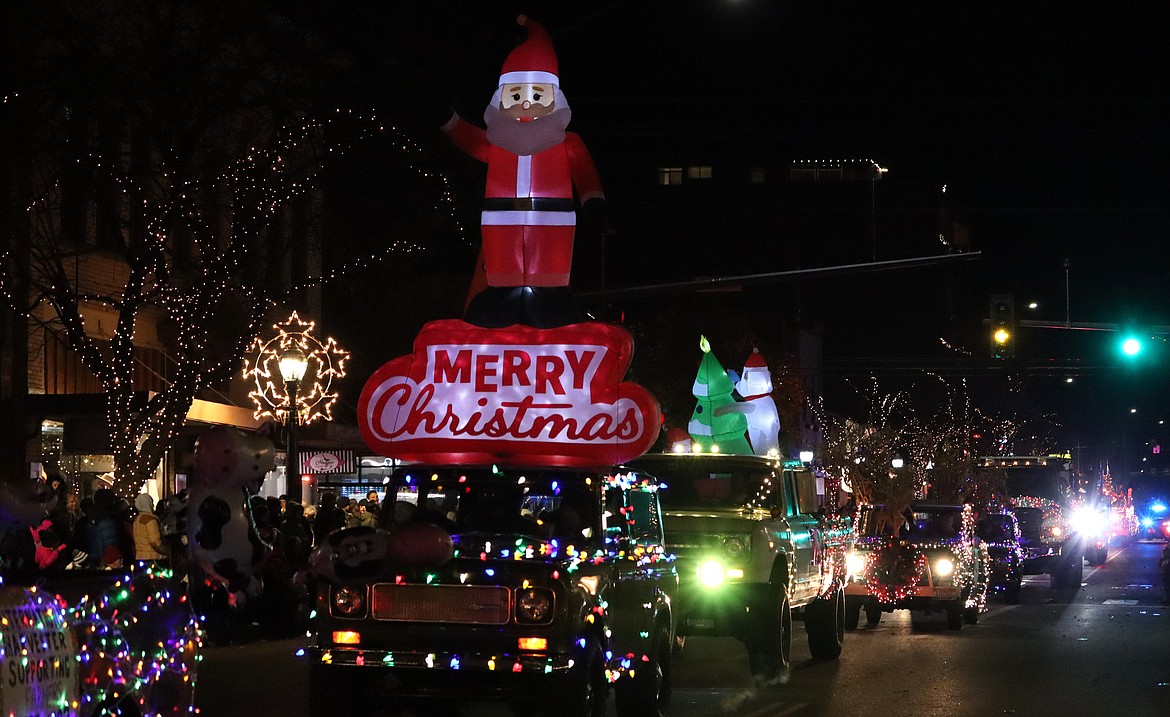 An inflatable Santa Claus is part of the Christmas parade in Coeur d'Alene.