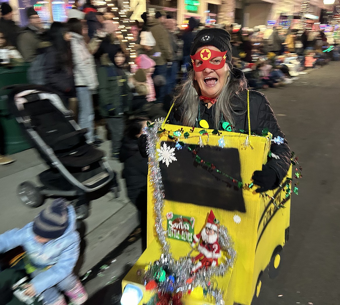 Karen Deering, a bus driver with the Coeur d’Alene School District, smiles during the parade on Friday.