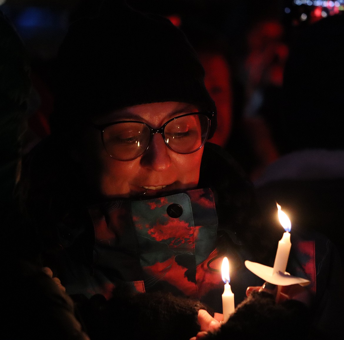 Ashley Langevin holds a candle during the lighting ceremony at The Coeur d'Alene Resort on Friday.