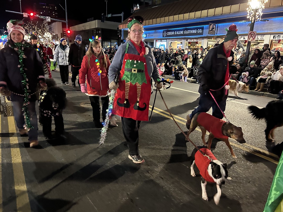 The Coeur d'Alene Dog Fanciers Club join the Christmas parade on Friday.