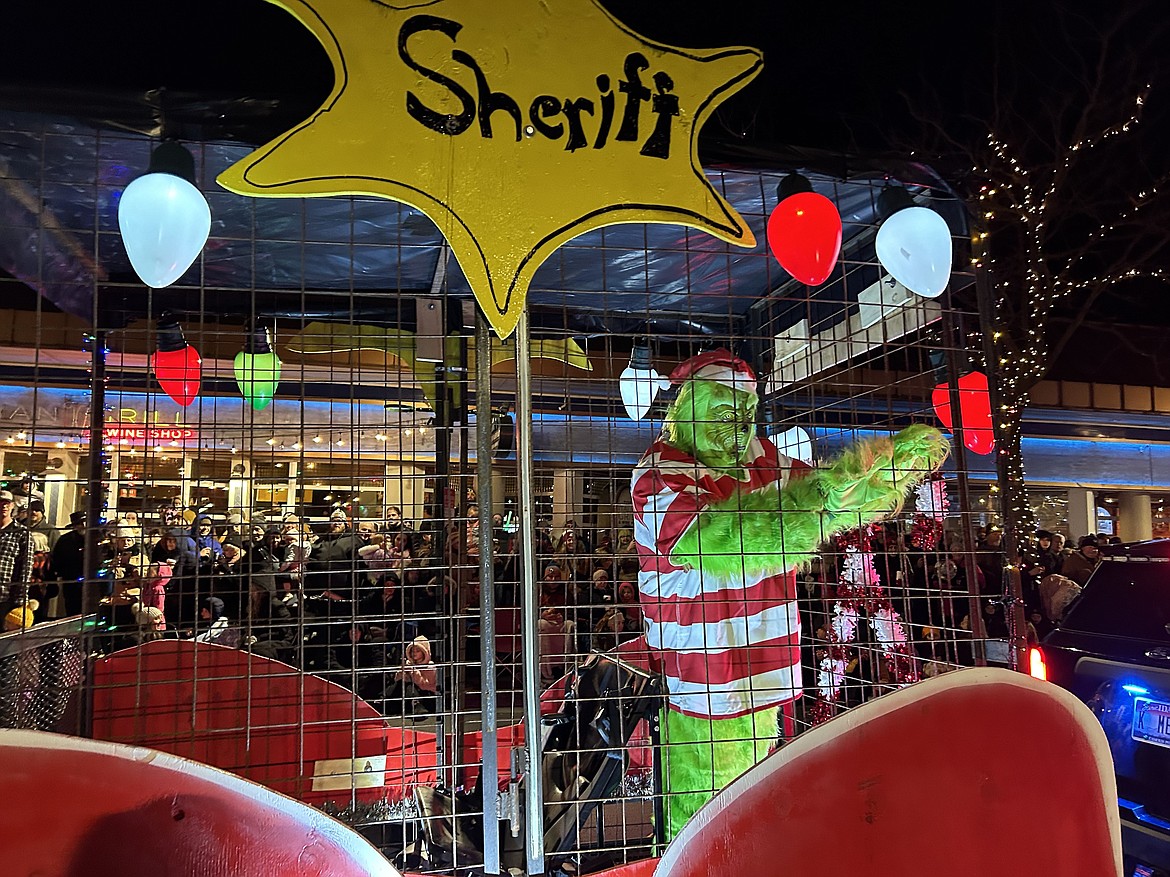 The Kootenai County Sheriff's Office has The Grinch behind bars in the parade.