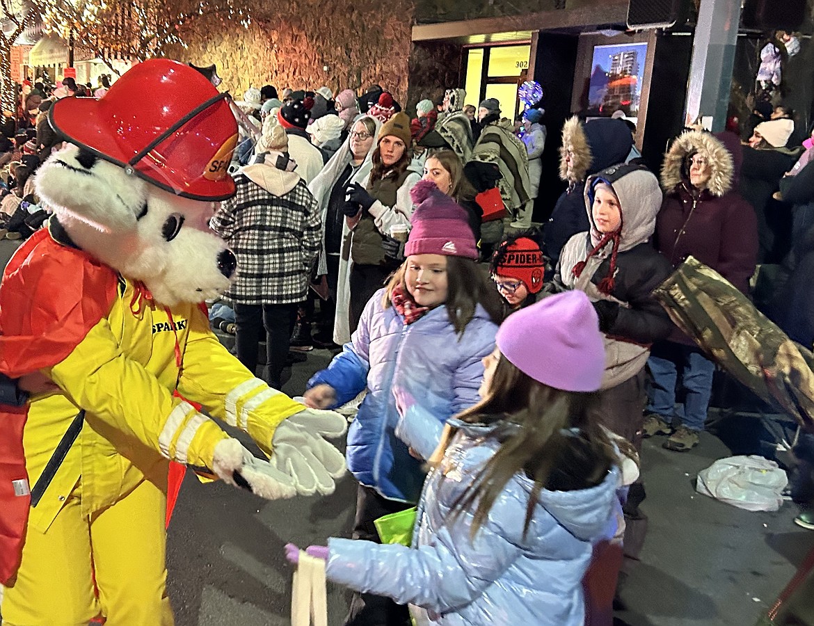 Sparky entertains the crowd during Friday's holiday parade.