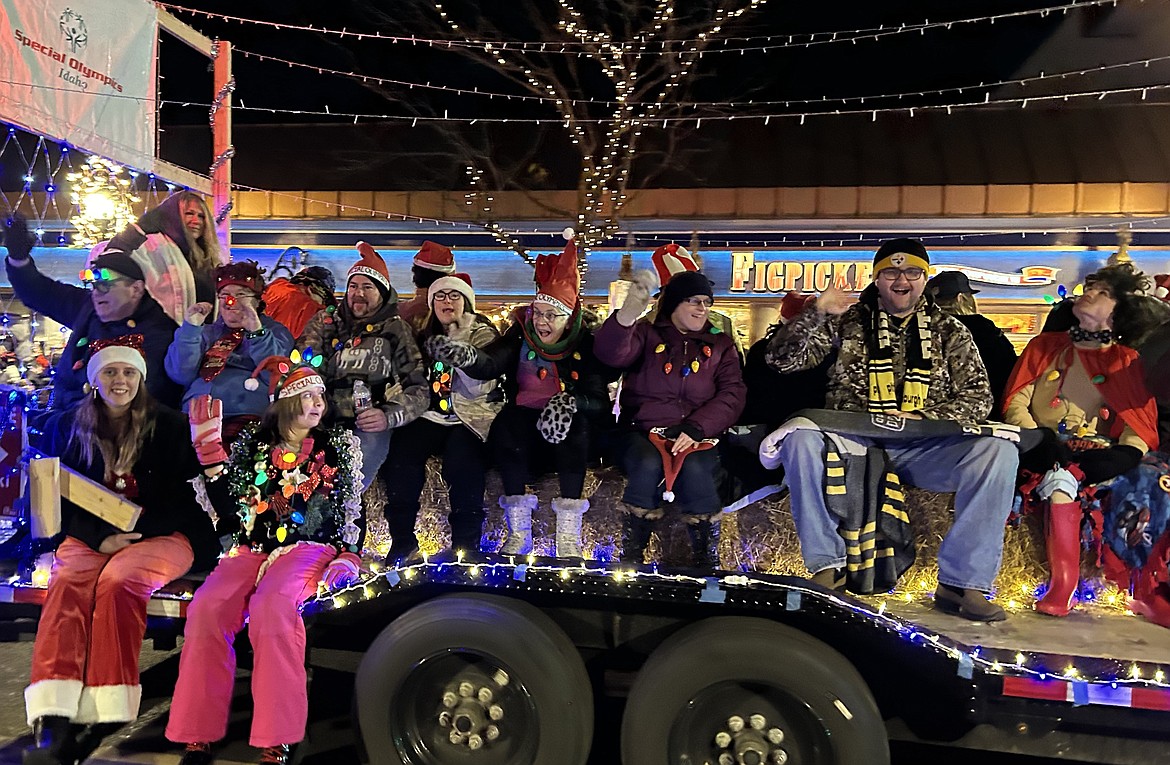 Special Olympians wave to the crowd during the parade Friday.