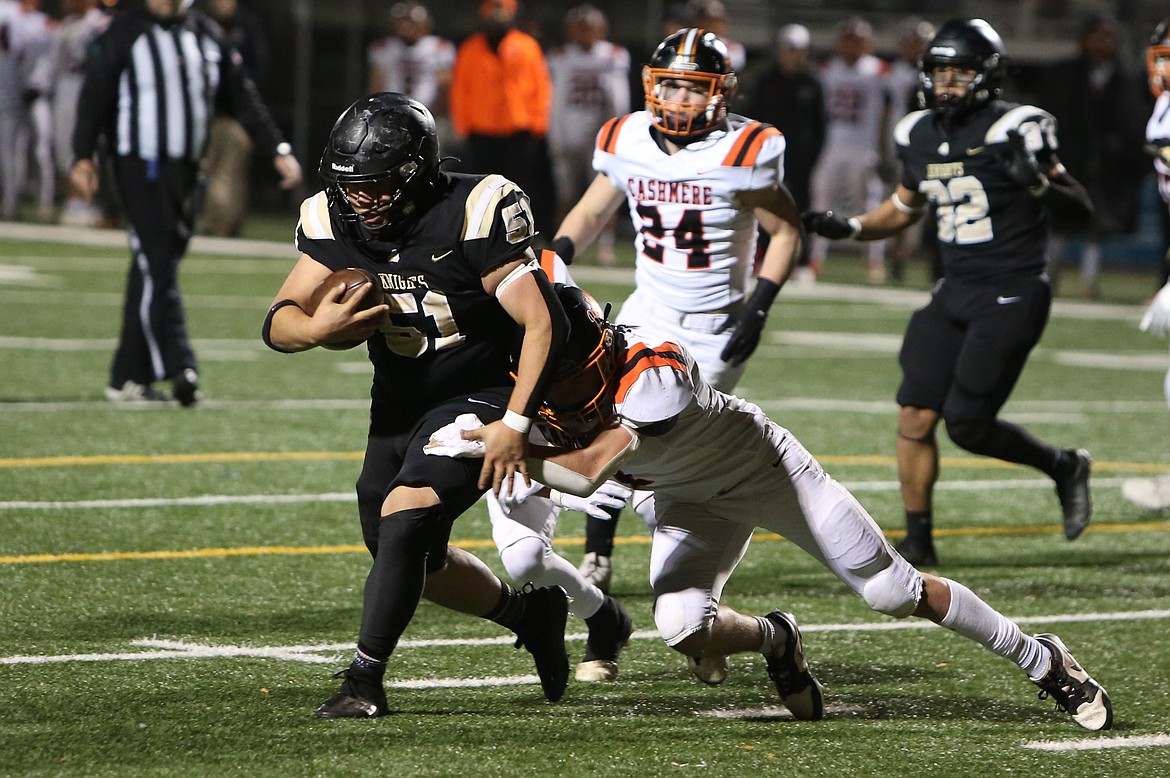 Royal senior Alex Arceo (51) carries the football on a run play in the fourth quarter of Saturday’s win over Cashmere.