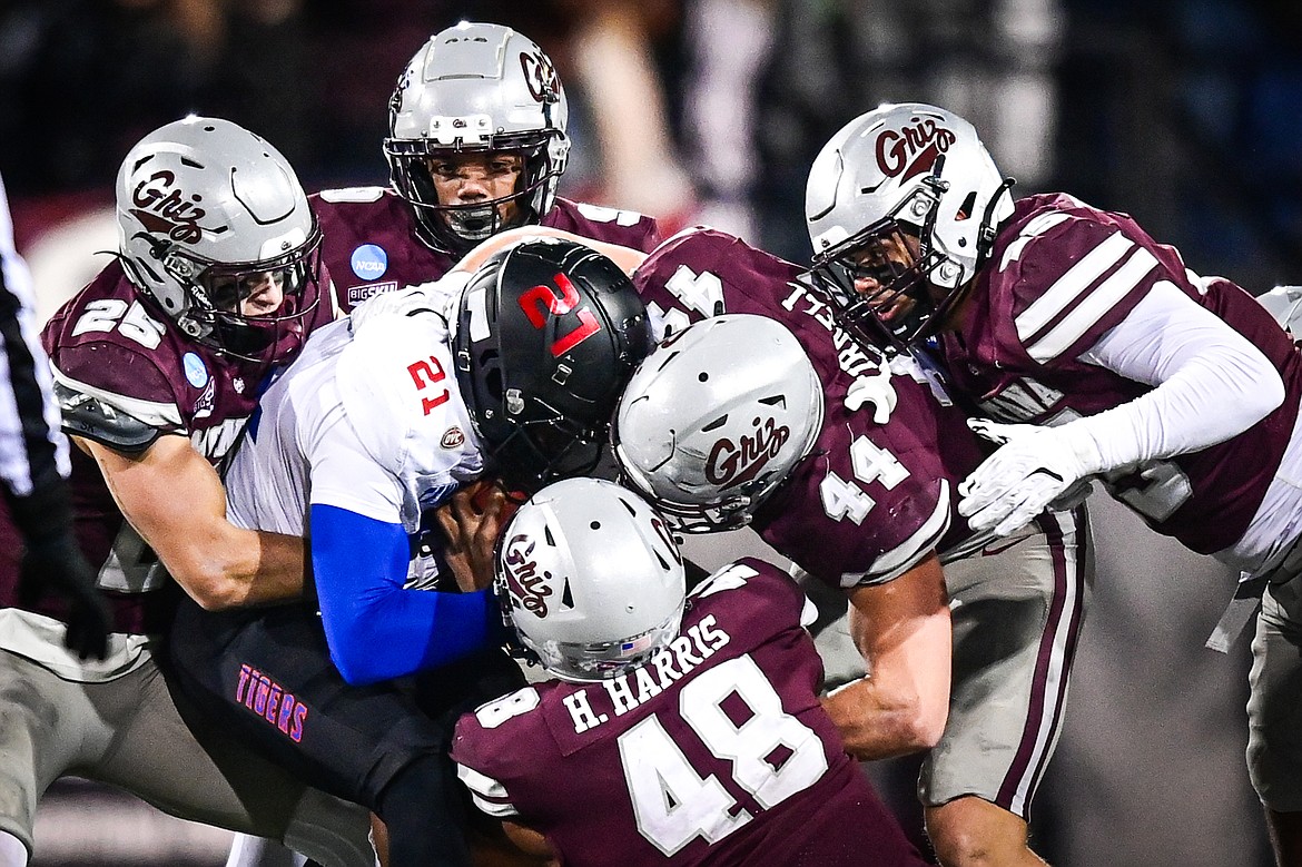 Grizzlies defenders stop a run by Tennessee State running back Tevin Carter (21) in the first quarter of the opening round of the FCS Playoffs at Washington-Grizzly Stadium on Saturday, Nov. 30. (Casey Kreider/Daily Inter Lake)