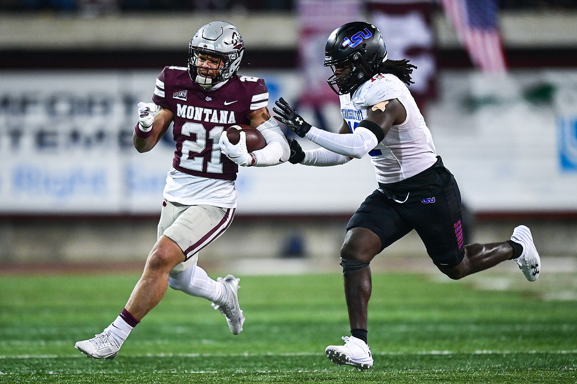 Grizzlies running back Stevie Rocker Jr. (21) picks up yardage on a run in the third quarter against Tennessee State in the first round of the FCS Playoffs at Washington-Grizzly Stadium on Saturday, Nov. 30. (Casey Kreider/Daily Inter Lake)