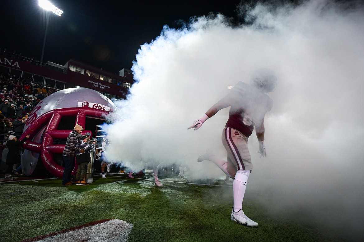 The Montana Grizzlies run out of the Topel Tunnel before their matchup with the Tennessee State Tigers in the first round of the FCS Playoffs at Washington-Grizzly Stadium on Saturday, Nov. 30. (Casey Kreider/Daily Inter Lake)