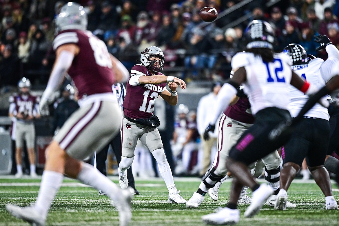 Grizzlies quarterback Logan Fife (12) drops back to pass in the third quarter against Tennessee State in the first round of the FCS Playoffs at Washington-Grizzly Stadium on Saturday, Nov. 30. (Casey Kreider/Daily Inter Lake)