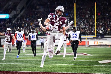 Grizzlies returner Junior Bergen (5) leaps into the end zone on a 52-yard punt return for a touchdown in the third quarter against Tennessee State in the first round of the FCS Playoffs at Washington-Grizzly Stadium on Saturday, Nov. 30. (Casey Kreider/Daily Inter Lake)<a href="https://dailyinterlake.dotphoto.com/">Click here to order photo reprints.</a>
