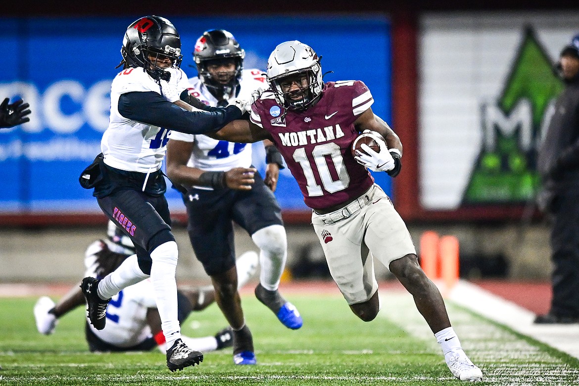 Grizzlies running back Eli Gillman (10) stiff-arms a defender on a 58-yard touchdown run in the fourth quarter against Tennessee State in the first round of the FCS Playoffs at Washington-Grizzly Stadium on Saturday, Nov. 30. (Casey Kreider/Daily Inter Lake)Click here to order photo reprints.