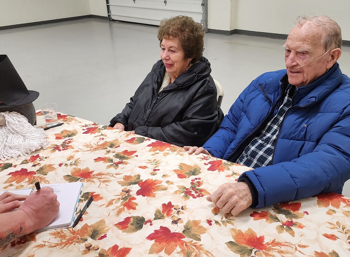 Community stalwarts Diane and Phil Grant greeted community members as they arrived at the Ronan Community Thanksgiving Dinner. (Berl Tiskus/Leader)