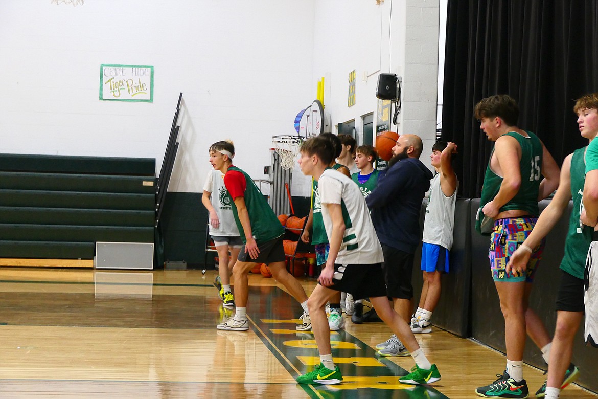 St. Regis players line up for running drills during an early morning practice this past week. The Tigers open the season at the Hamilton Tip-off tourney this Friday. (Chuck Bandel/VP-MI)