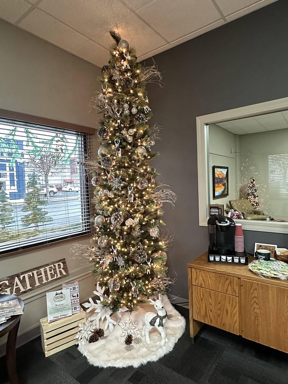 This wintry tree, almost too tall for the Columbia Basin Foundation office ceiling, was donated by Tommer Construction for the foundation’s Festival of Trees raffle. Proceeds benefit the Guardian ad Litem program.