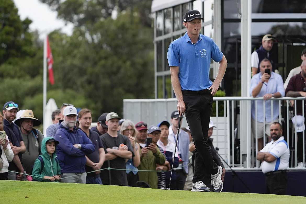 Ryggs Johnston of the United States waits to putt on the 18th green during the final round of the Australian Open golf championship at the Kingston Heath Golf Club in Melbourne, Australia, Sunday, Dec. 1, 2024. (AP Photo/Asanka Brendon Ratnayake)