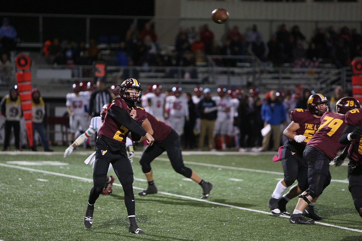 Moses Lake junior Brady Jay, left, throws a pass into the flat during a game against Eastmont. Jay received Columbia Basin Big 9 League MVP, Offensive MVP and first-team quarterback honors.