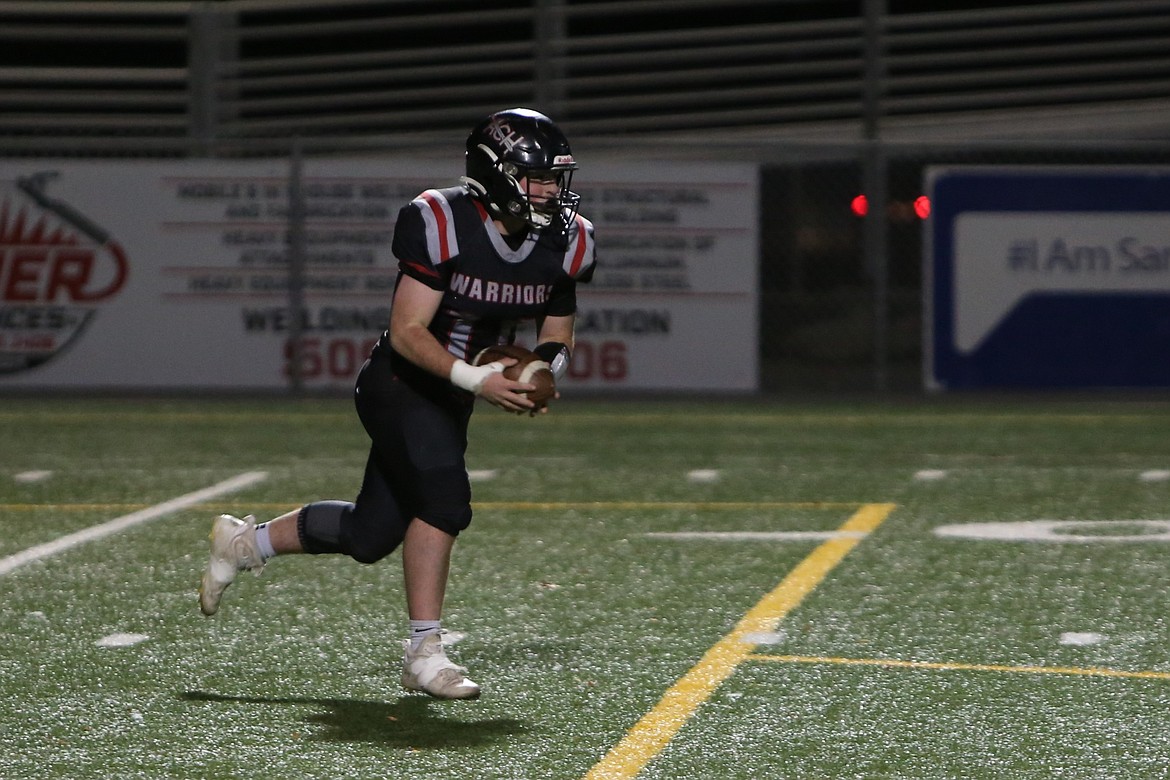 Almira/Coulee-Hartline senior Carter Pitts returns an intercepted pass during a playoff game against Inchelium. Pitts received Defensive MVP honors in the Northeast 1B league this season.