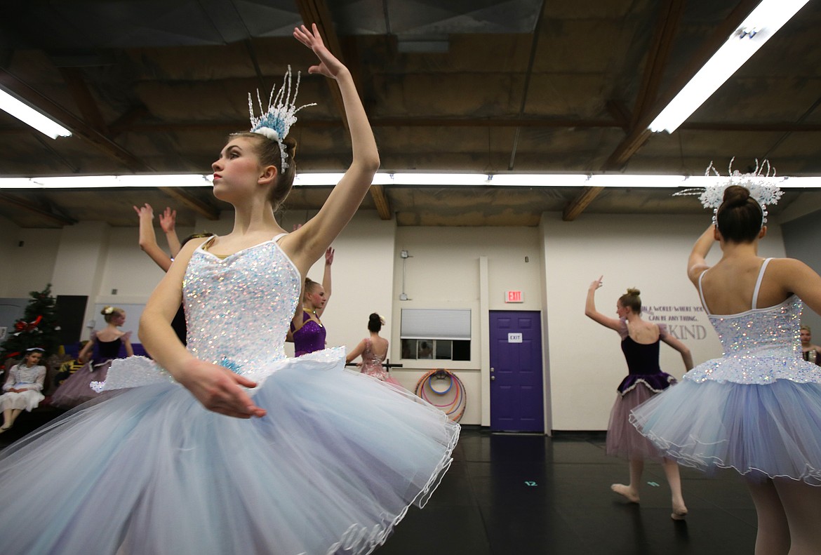 Emma Shafer, aglitter in her Snow Princess costume, rehearses a dance sequence with her castmates Dec. 2 at Dance Theatre Northwest in Rathdrum.