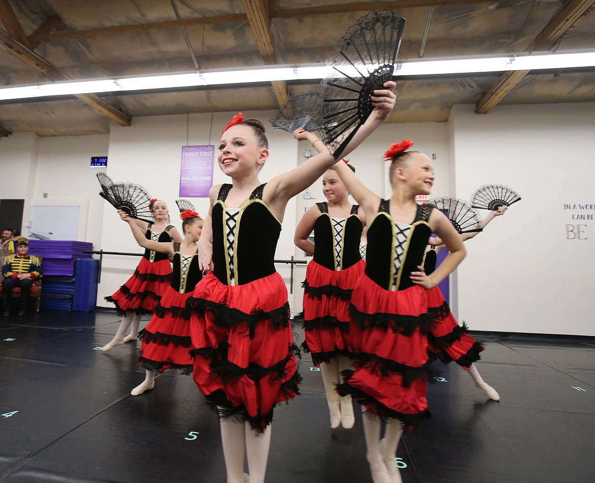 Paxton St. Mark, center, fans out with her fellow Spanish dancers Dec. 2 during rehearsal for "The Nutcracker."