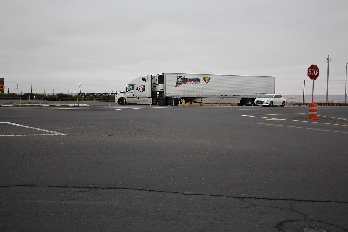 A semi exits State Route 26 for State Route 24 at South First Avenue in Othello. A roundabout is scheduled for construction at the intersection in 2025.