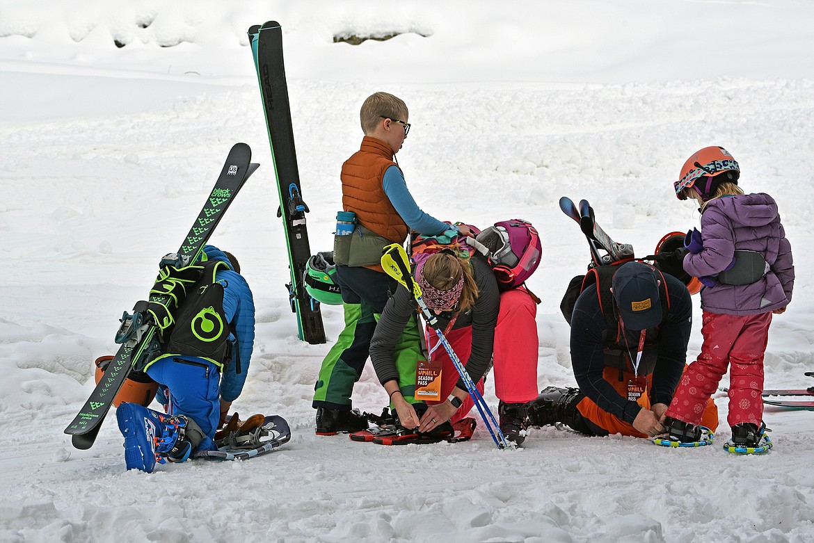 A family prepares to snowshoe up the east route on Big Mountain on Dec. 1. (Kelsey Evans/Whitefish Pilot)