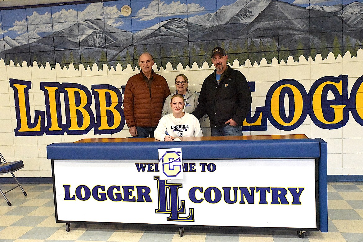 Libby High School senior Morgan Hayes signs her letter of intent to play soccer at Carroll College in Helena. Joining her Wednesday, Dec. 3, 2024, at Libby Middle High School were her father John and grandparents Jill and Tony Petrusha. (Scott Shindledecker/The Western News)