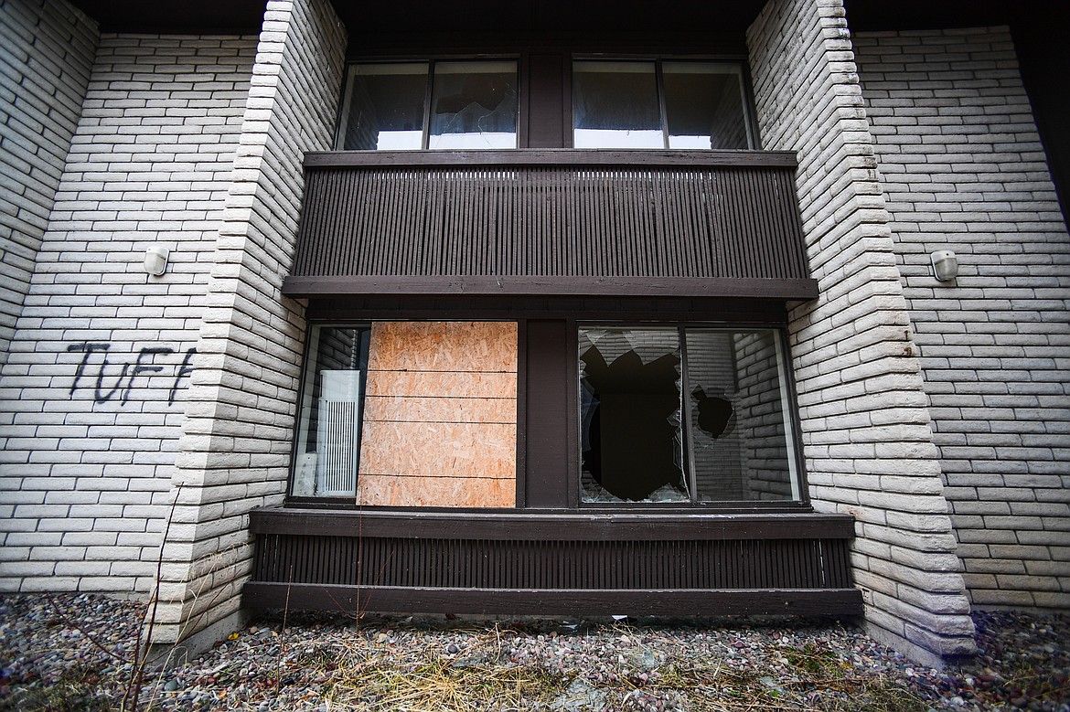 A boarded-up and broken window at the former Fairbridge Inn & Suites and Outlaw Convention Center in Kalispell on Wednesday, Dec. 4. (Casey Kreider/Daily Inter Lake)