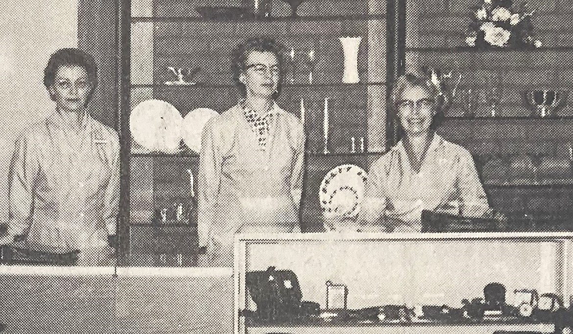 In 1964, S&H Green Stamps clerks, from left, Mrs. Barney Samson, Mrs. Hank Schultz and Mrs. Bob Boughton wait for customers.